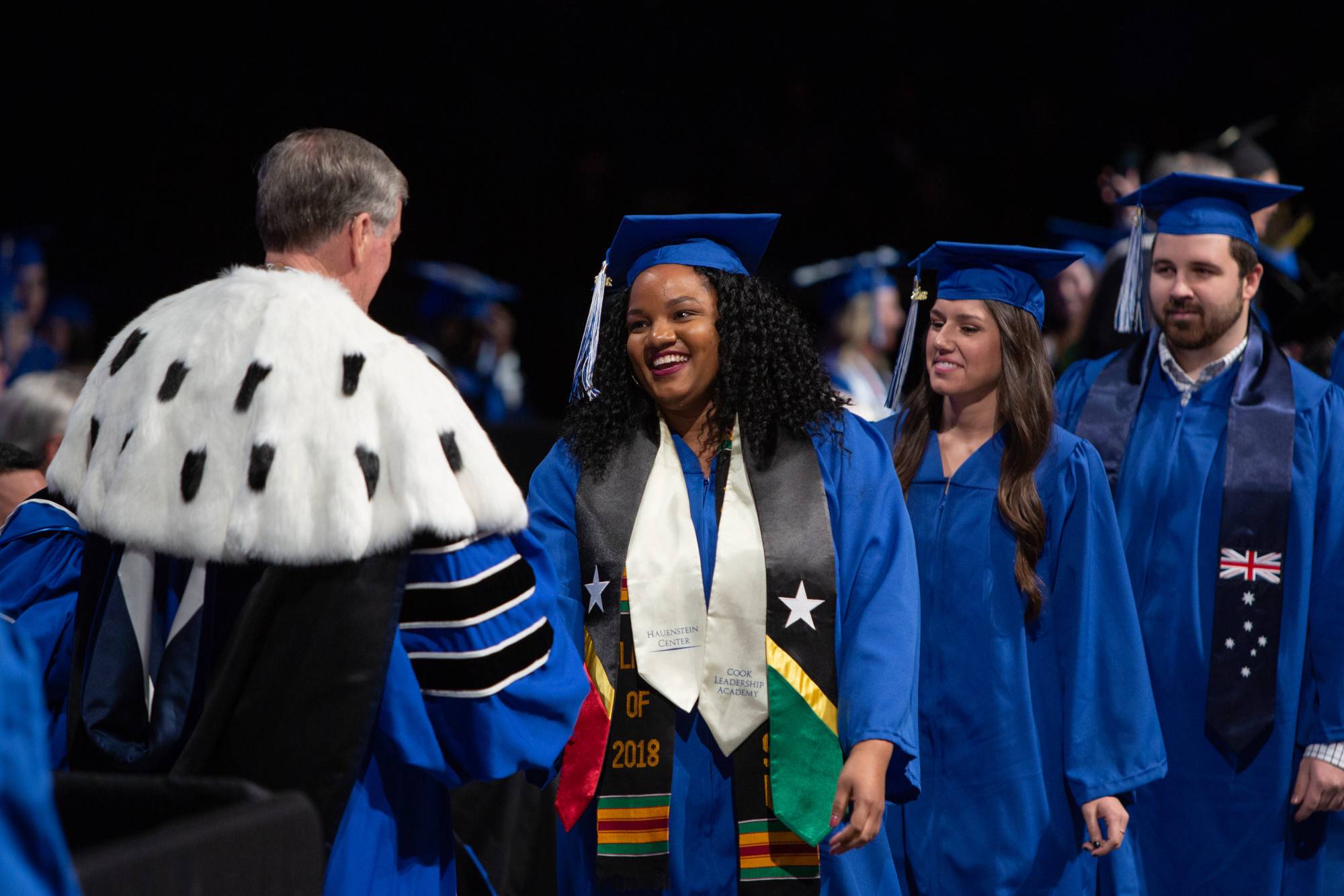 A 2018 grad crosses the stage at Commencement